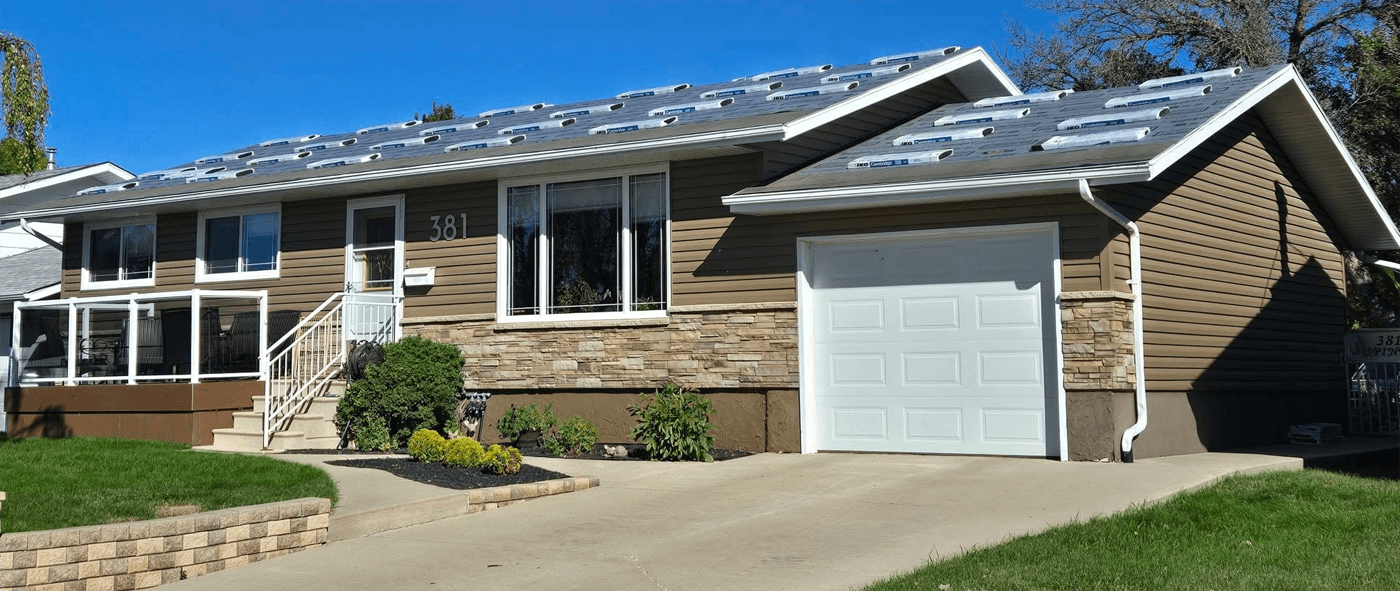 Picture of a a Home with Arsenal Roofing Truck Out Front