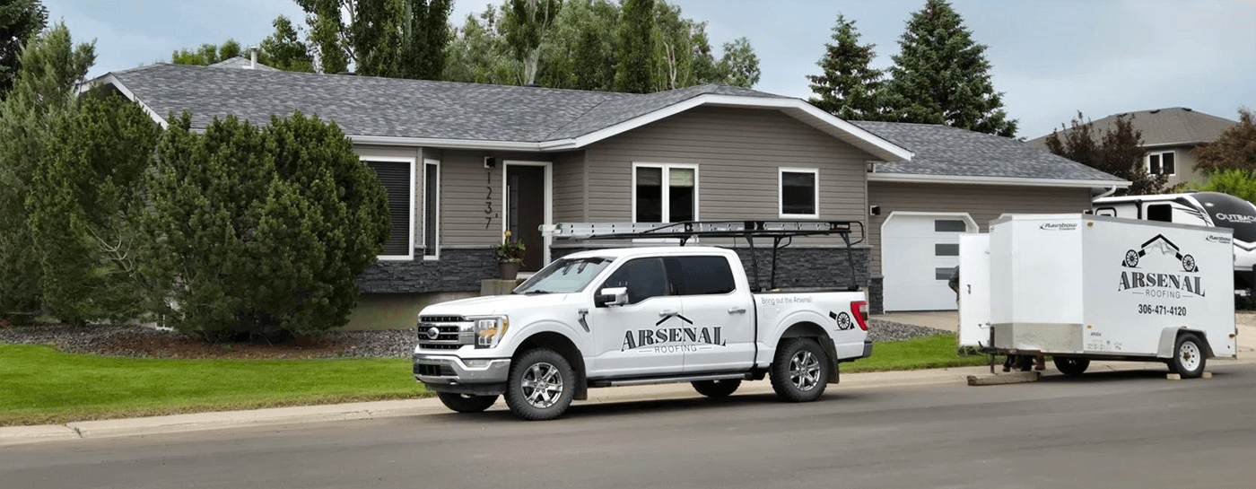 Picture of a a Home with Arsenal Roofing Truck Out Front